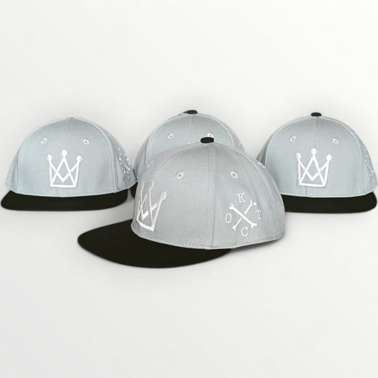 king of the court Grey and black kids snapback hat with white crown logo side view