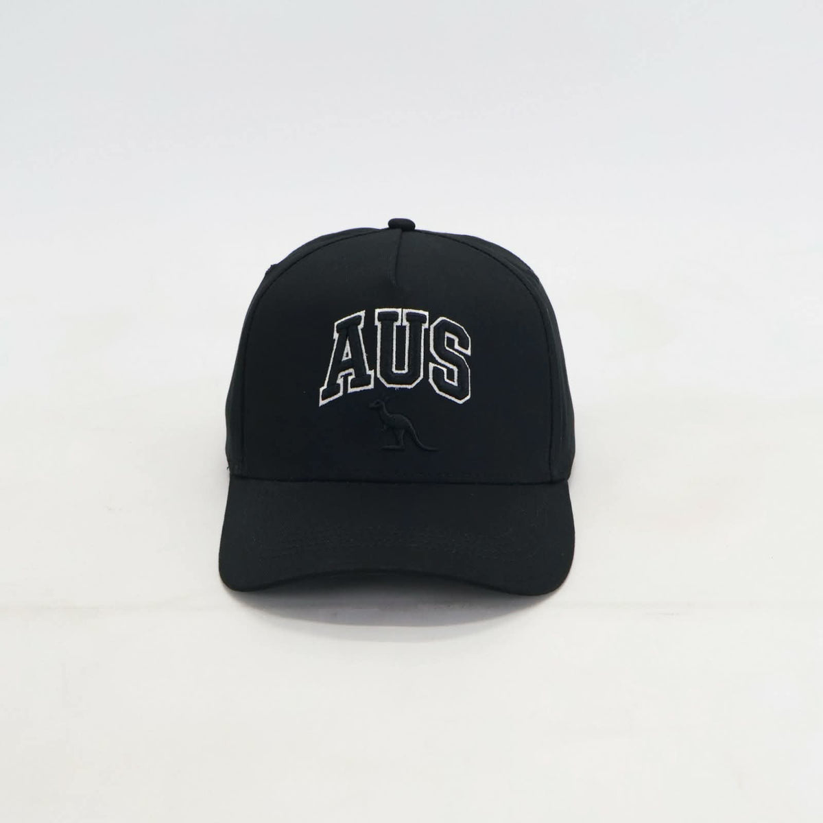 A black baseball cap featuring 'AUS' embroidered in white arched letters on the front, with a small black kangaroo logo underneath, set against a plain white background.