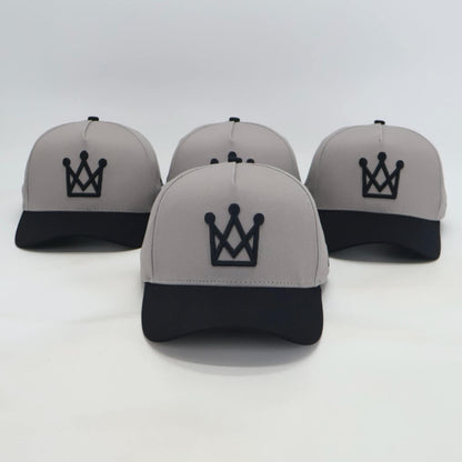 Grey and black snapback hat with embroidered crown logo front view