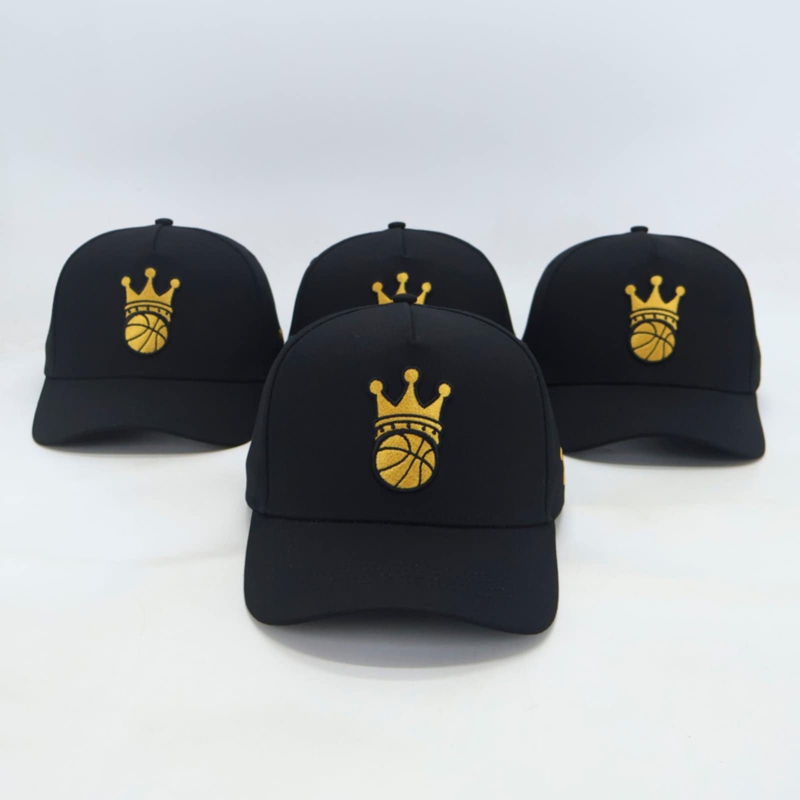 Black Snapback hat with gold ball/crown logo - front view