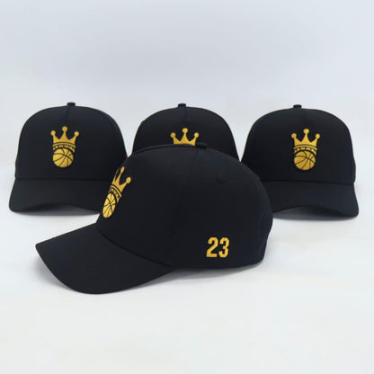 Black Snapback hat with gold ball/crown logo - side view