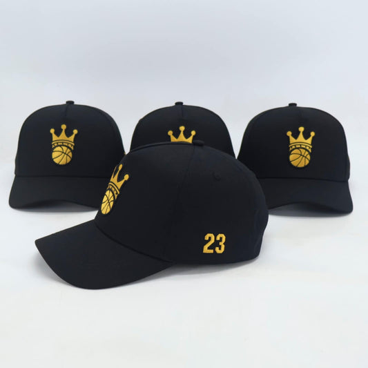 Black Snapback hat with gold ball/crown logo - side view