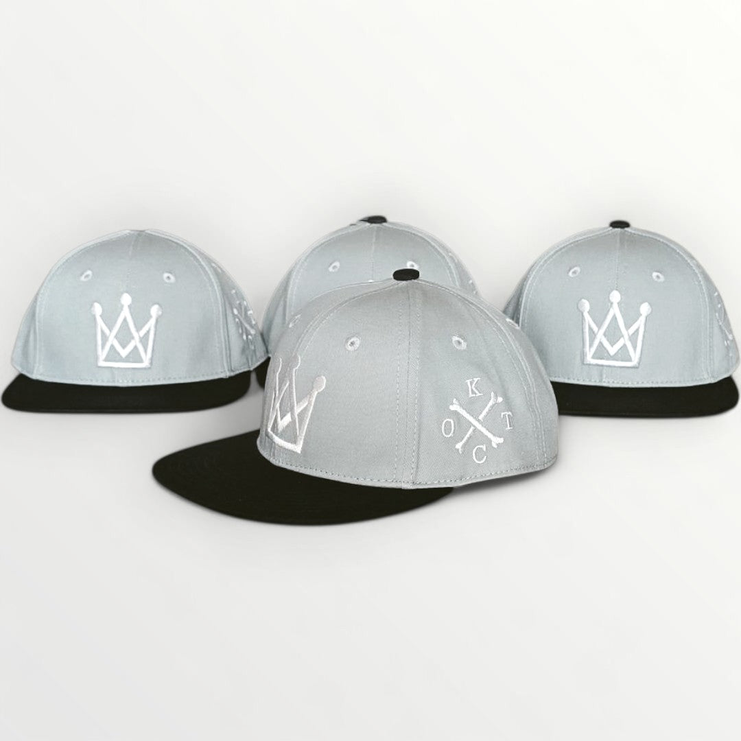 king of the court Grey and black kids snapback hat with white crown logo side view